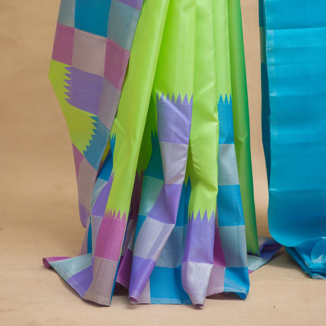 pista green -plain body with checked border & blue colour pallu with unstitched blouse